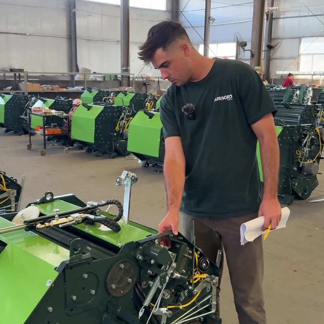 Aus Agro team inspecting machinery in the workshop